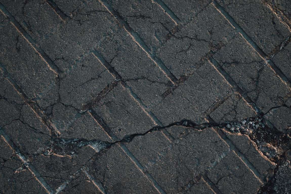 Close-up of cracking asphalt